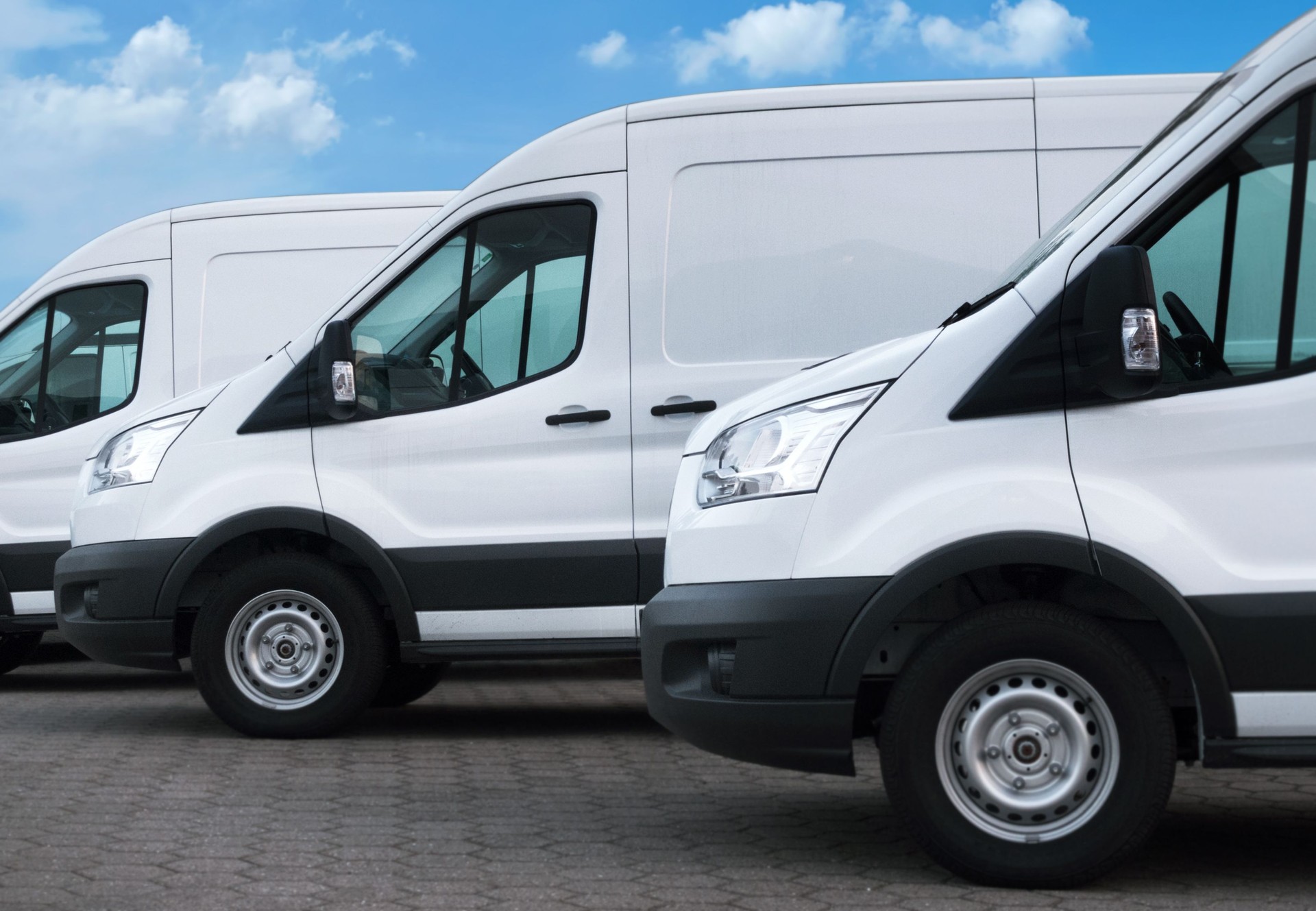 White delivery vans in a row